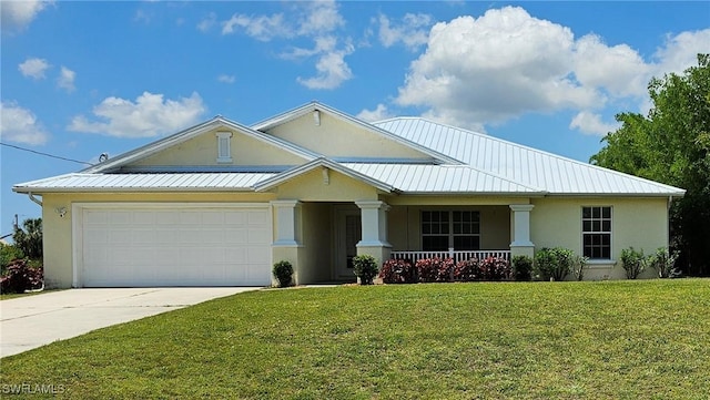 view of front facade with a garage, covered porch, and a front yard