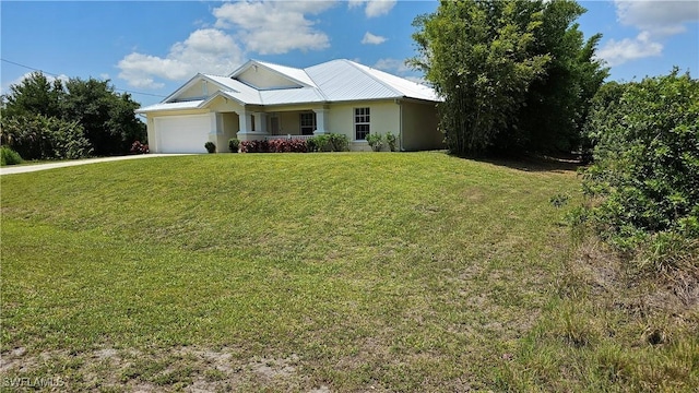 view of front facade with a garage and a front yard