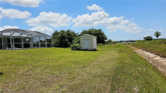 view of yard featuring a storage shed and a lanai