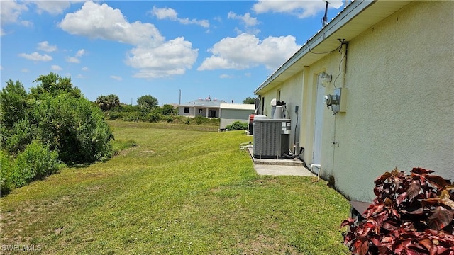 view of yard with central air condition unit