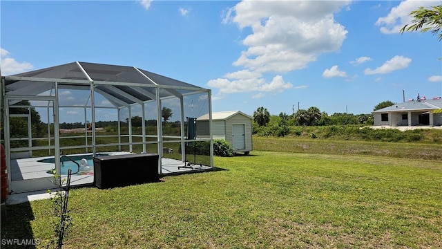 view of yard featuring glass enclosure and a storage unit