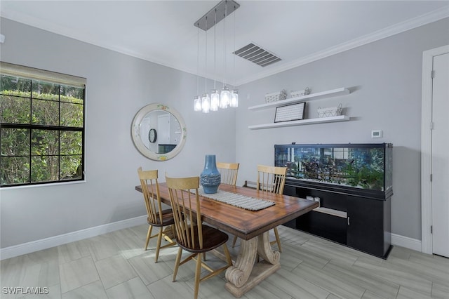 dining room featuring ornamental molding