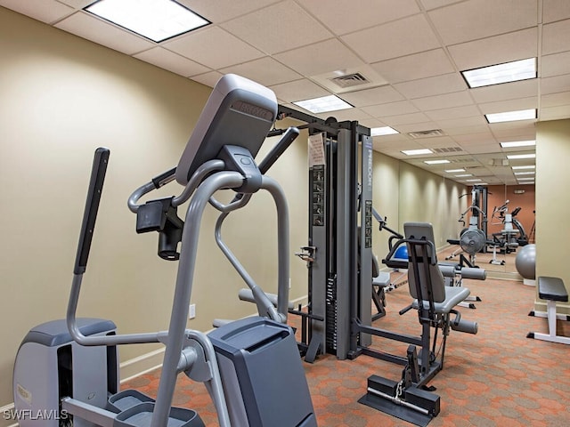 exercise room featuring a drop ceiling