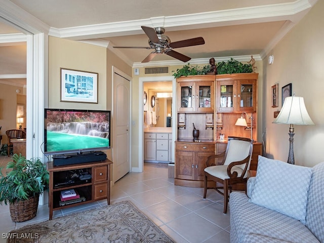 interior space featuring ceiling fan, ornamental molding, and light tile patterned floors