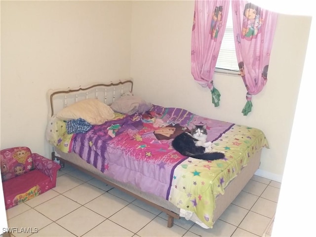 bedroom featuring light tile patterned flooring