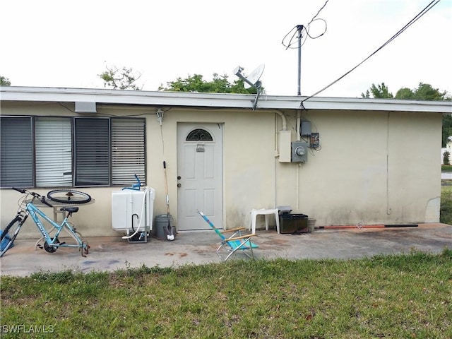 back of house with a patio