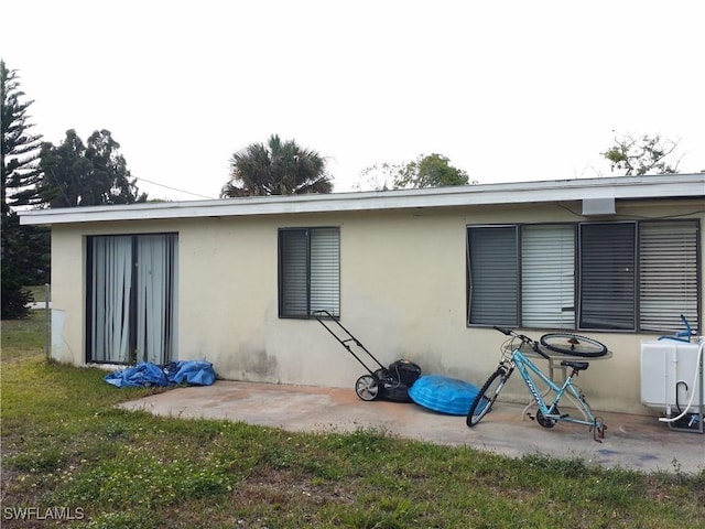 rear view of house featuring a patio