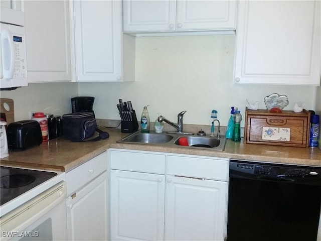 kitchen featuring sink, white cabinetry, and black dishwasher