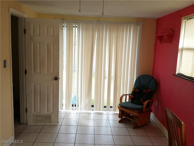 sitting room featuring light tile patterned floors