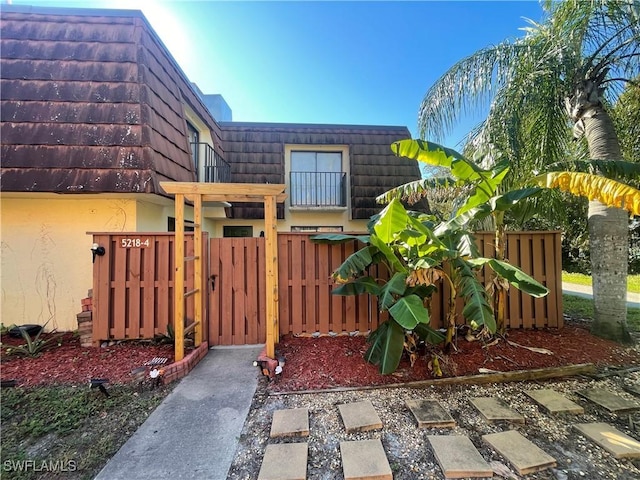 exterior space with a gate and fence