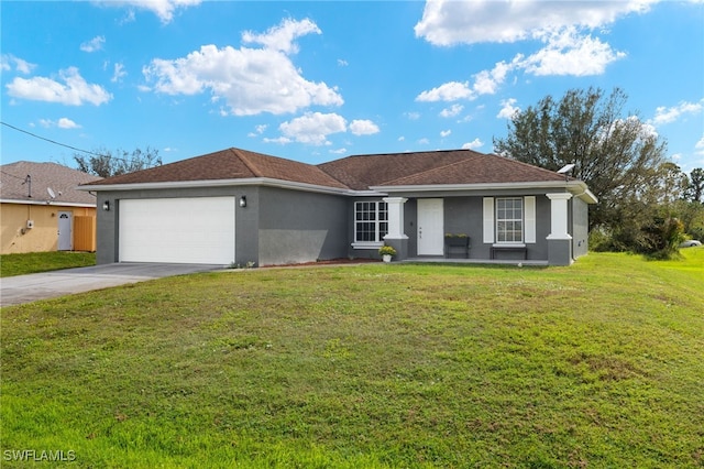 ranch-style house featuring a garage and a front yard