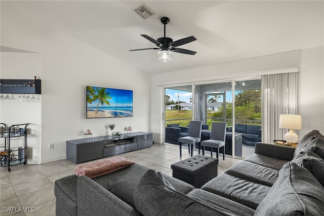 tiled living room featuring ceiling fan and lofted ceiling