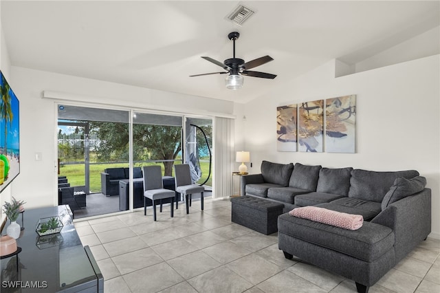 tiled living room with vaulted ceiling and ceiling fan