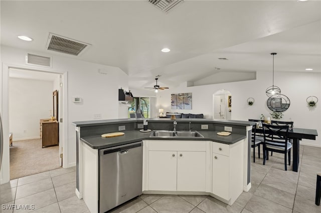 kitchen featuring white cabinets, dishwasher, sink, and an island with sink