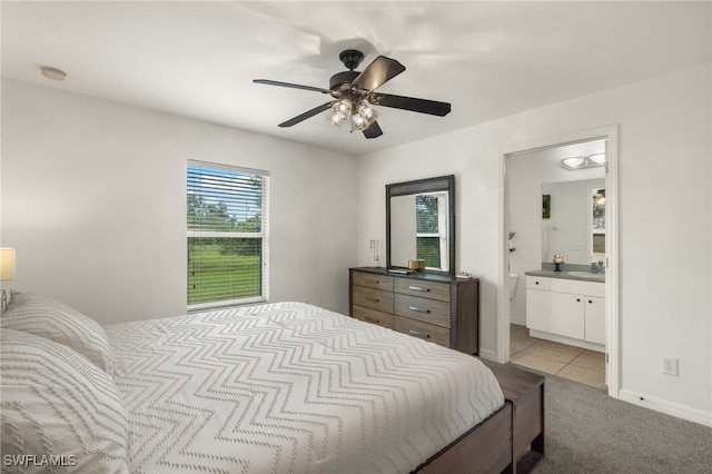 carpeted bedroom featuring ceiling fan, sink, and ensuite bathroom