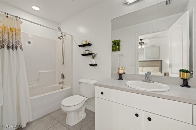 full bathroom featuring tile patterned floors, vanity, shower / tub combo with curtain, ceiling fan, and toilet