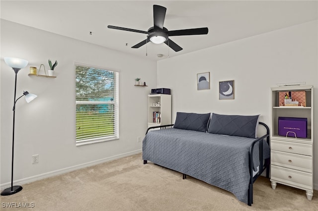 carpeted bedroom featuring ceiling fan