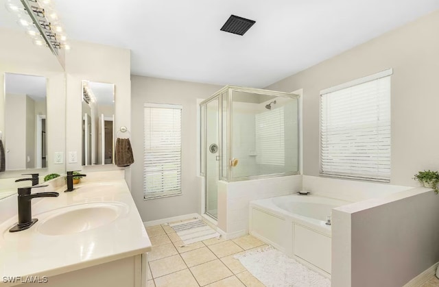 bathroom featuring tile patterned flooring, shower with separate bathtub, vanity, and a chandelier