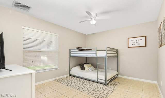 tiled bedroom with ceiling fan