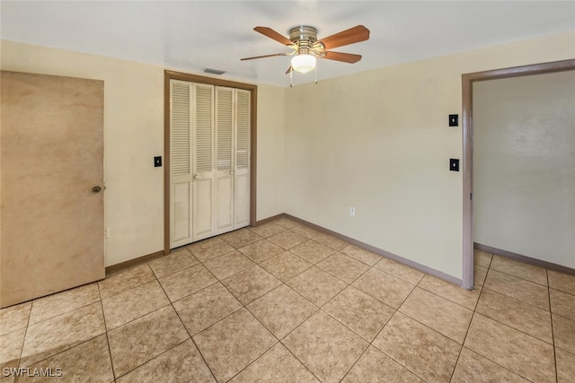 unfurnished room with ceiling fan