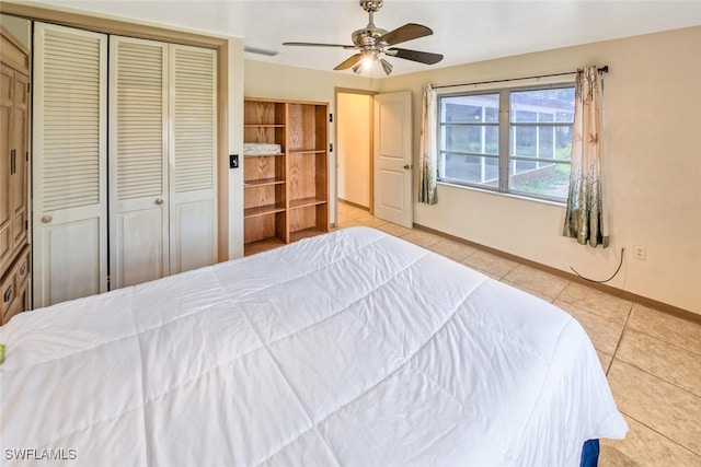 tiled bedroom with ceiling fan