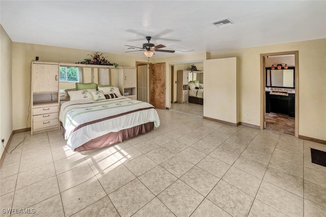 tiled bedroom with ceiling fan