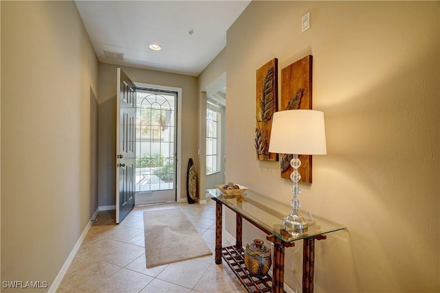 entrance foyer featuring light tile patterned floors