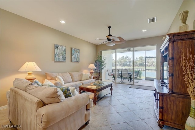 living room with ceiling fan and light tile patterned floors