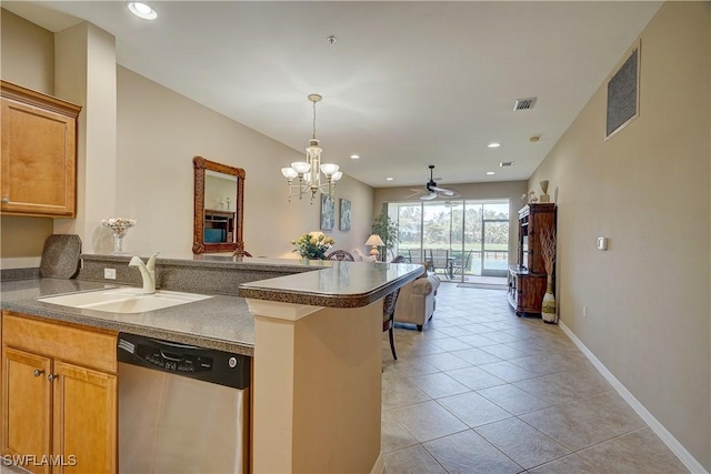 kitchen with dishwasher, sink, kitchen peninsula, light tile patterned floors, and ceiling fan with notable chandelier