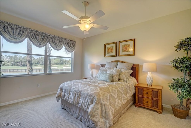 bedroom featuring light carpet and ceiling fan