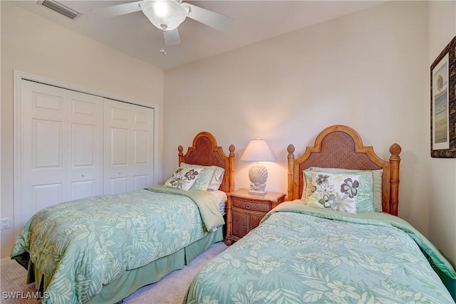 bedroom with carpet flooring, ceiling fan, and a closet