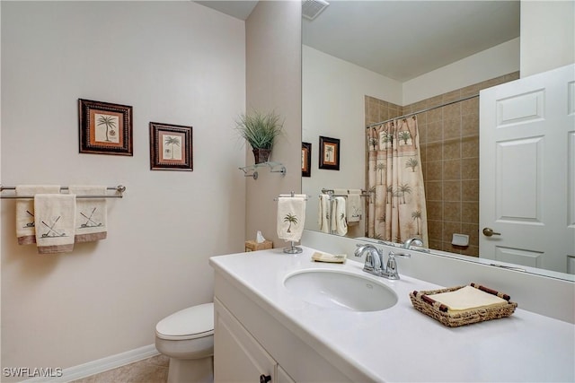 bathroom featuring tile patterned floors, curtained shower, vanity, and toilet