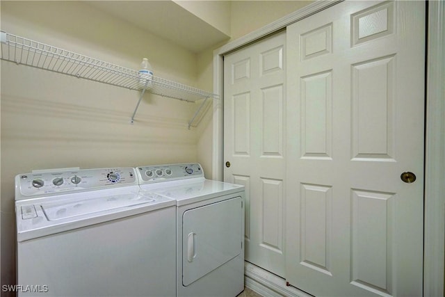 laundry room with independent washer and dryer