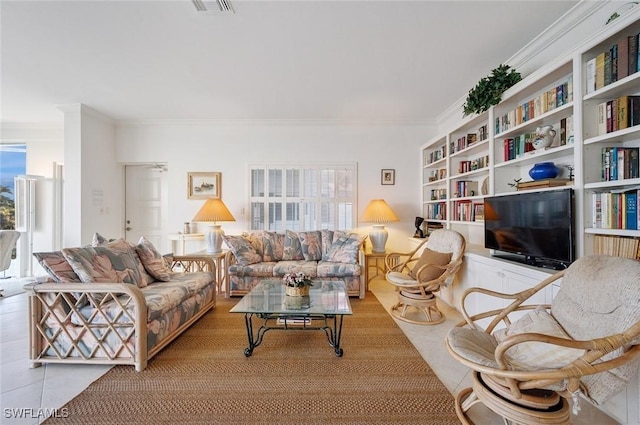 living room featuring crown molding