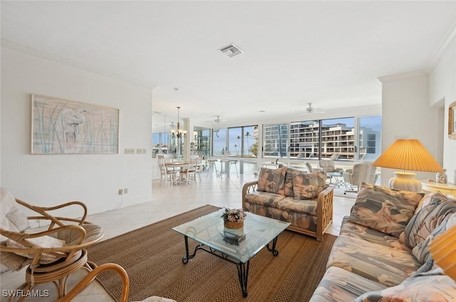 2246 Gulf Shore Blvd N Unit L2, Naples, FL 34102 - living room featuring light tile patterned flooring, expansive windows, visible vents, and ornamental molding