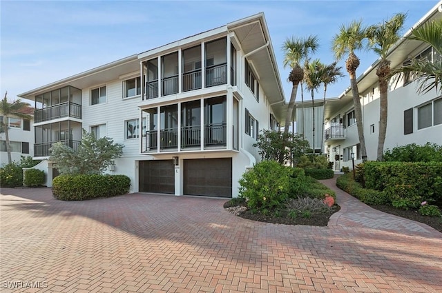 2246 Gulf Shore Blvd N Unit L2, Naples, FL 34102 - view of building exterior featuring decorative driveway and a garage