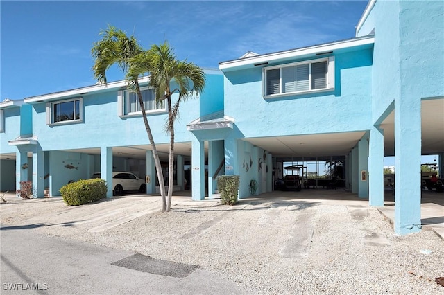 view of front of home featuring a carport