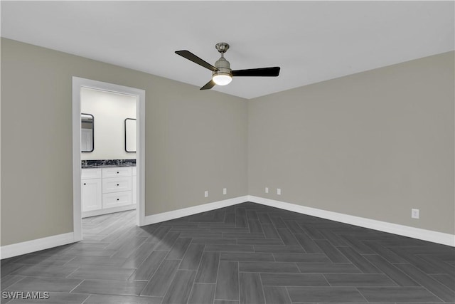 unfurnished bedroom with connected bathroom and ceiling fan