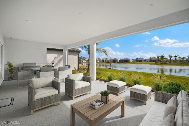 view of patio / terrace featuring outdoor lounge area and a water view