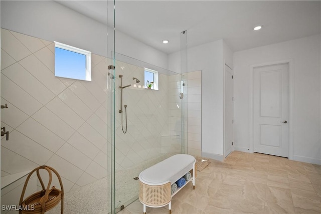 bathroom featuring tiled shower