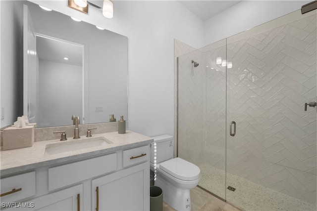 bathroom featuring walk in shower, tile patterned flooring, vanity, and toilet