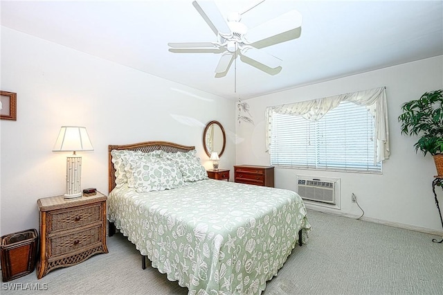 bedroom with a wall mounted AC, ceiling fan, and light carpet