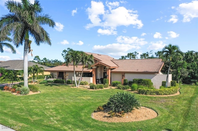 single story home featuring a front lawn