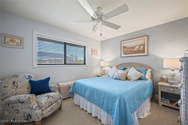 bedroom featuring light colored carpet and ceiling fan