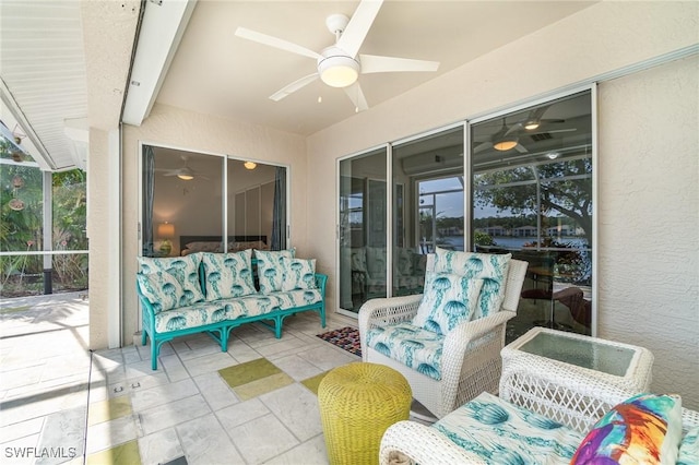 view of patio with a lanai and ceiling fan