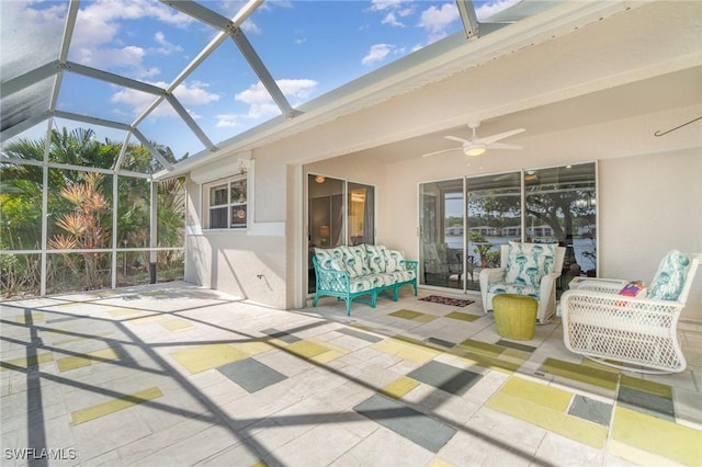 view of patio with ceiling fan and a lanai