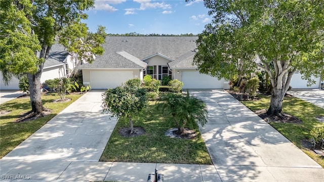 view of front of house with a front lawn and a garage