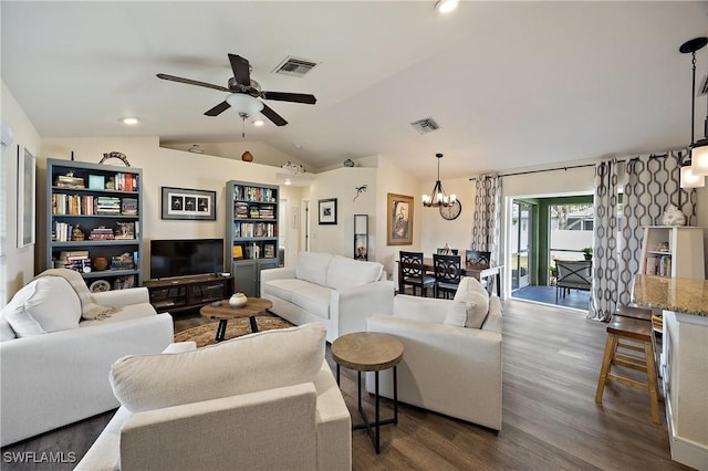 living room with vaulted ceiling, dark wood-type flooring, and ceiling fan with notable chandelier