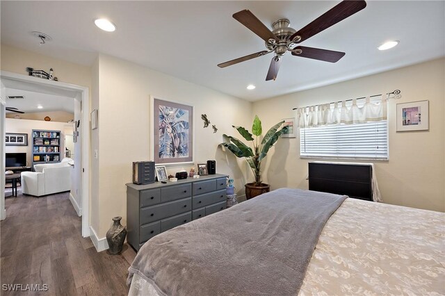 bedroom with ceiling fan and dark hardwood / wood-style flooring