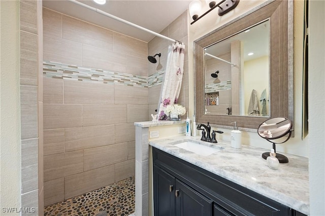 bathroom with vanity and a shower with shower curtain